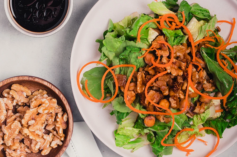 Fresh vegetable salad with walnuts