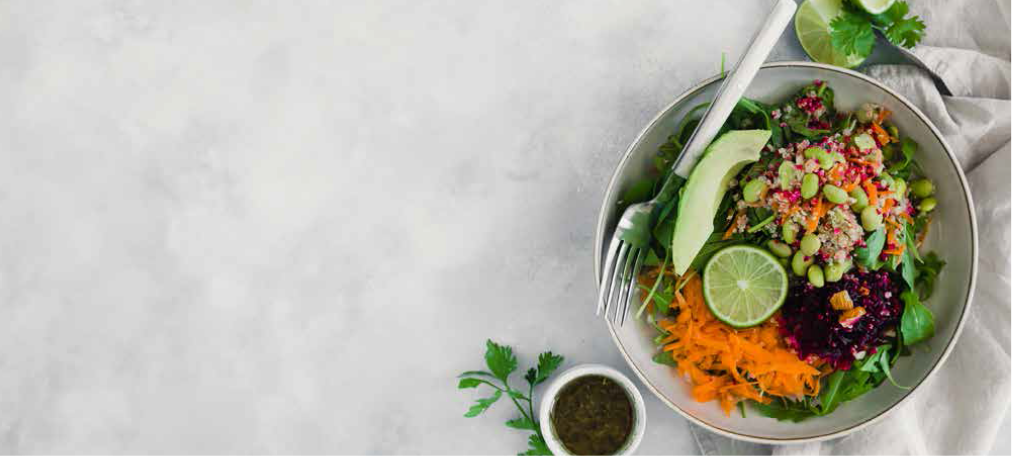 A colourful bowl of fresh vegetables and grains